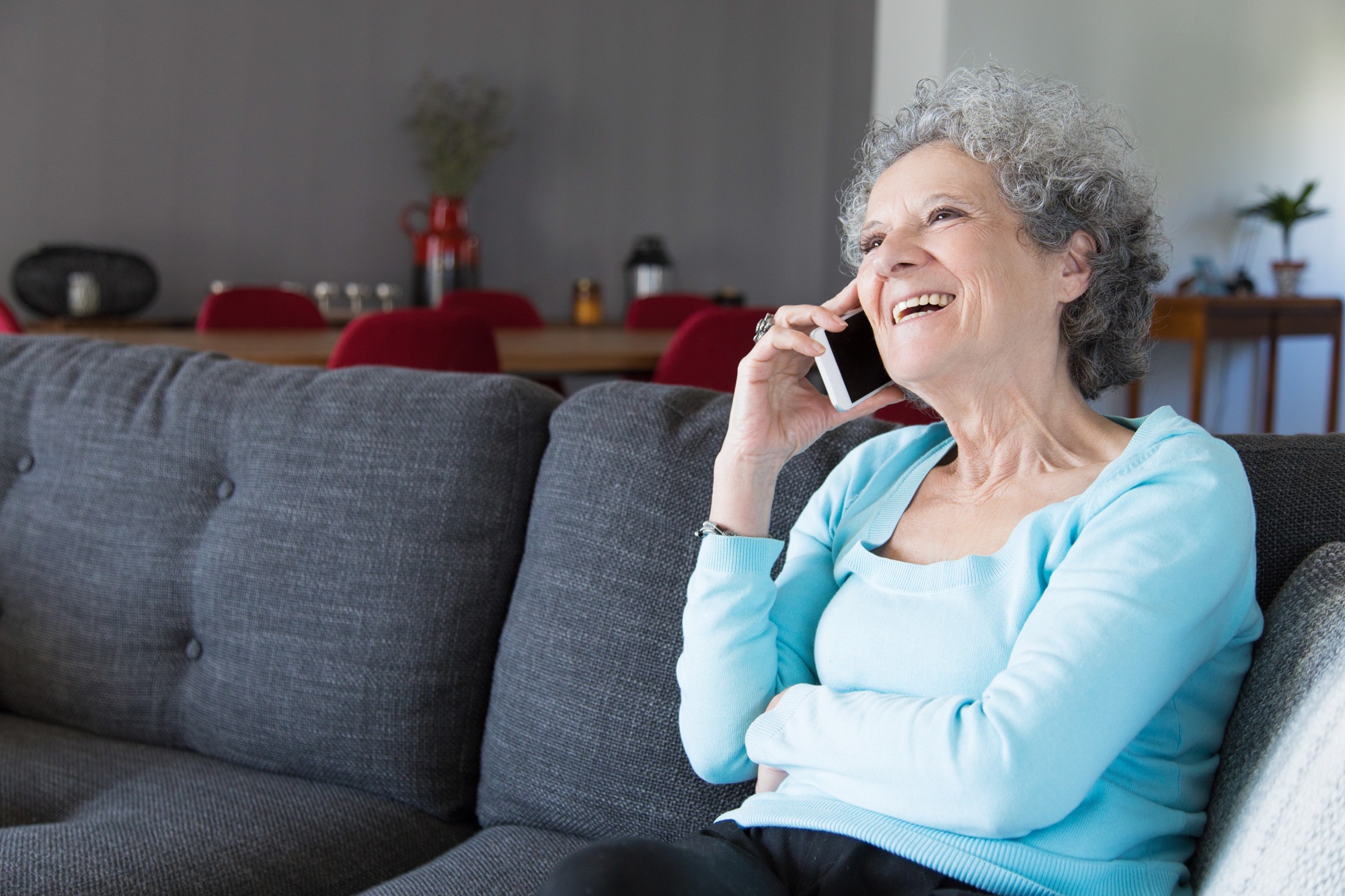 elderly person being taken care by female-caregiver