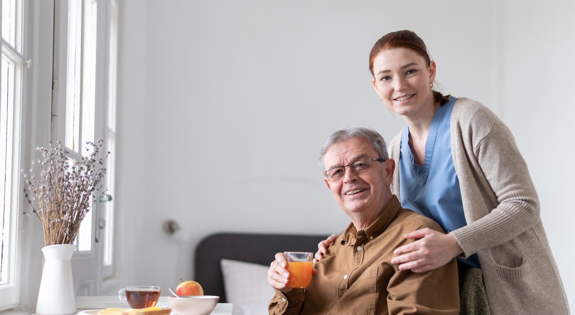 ultimate home care staff attending to client